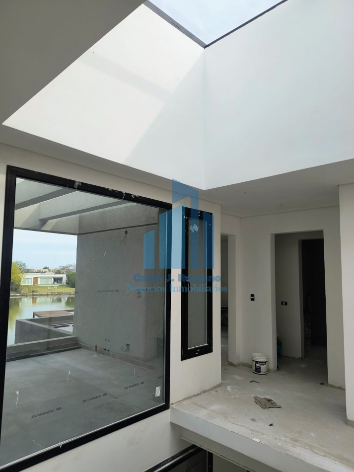 VENTA CASA A TERMINAR de 6 AMBIENTES EN BARRIO EL CANTON CON VISTA A LAGUNA , ESCOBAR
